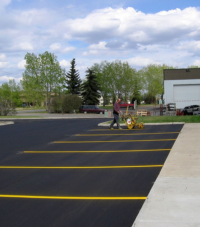 Photo of Painting Lines on Finished Asphalt Surface